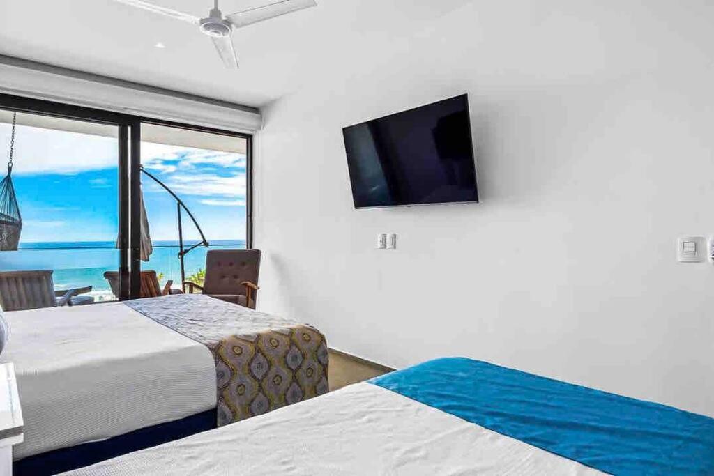 Apartamento ~beach Front~stunning Views~free Airport Transport *